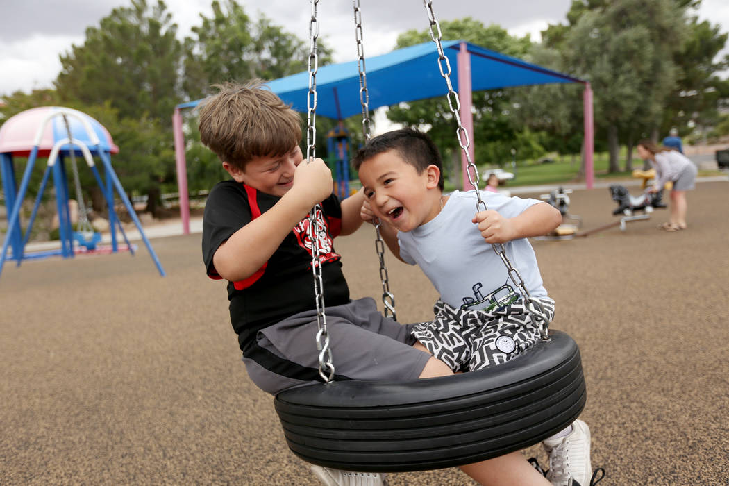 Eli Reyes, 10, left, plays with his brother Alec Reyes, 5, at Bicentennial Park in Boulder City ...