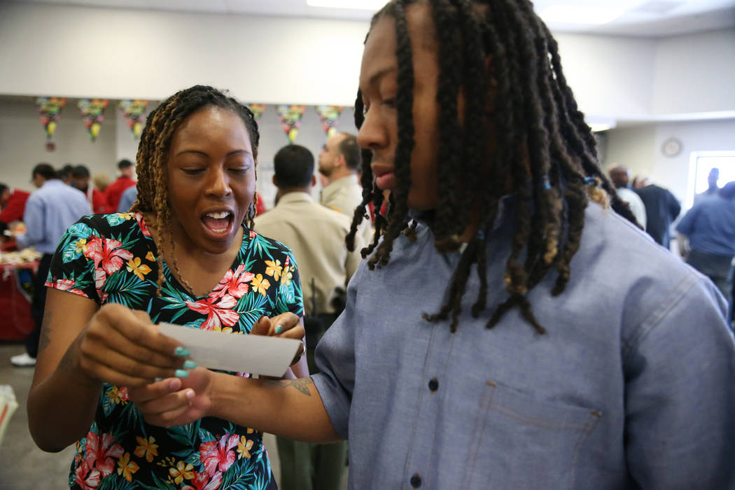 Inmate Trayvon Ward, right, 19, a former high school football standout from Las Vegas, shows hi ...