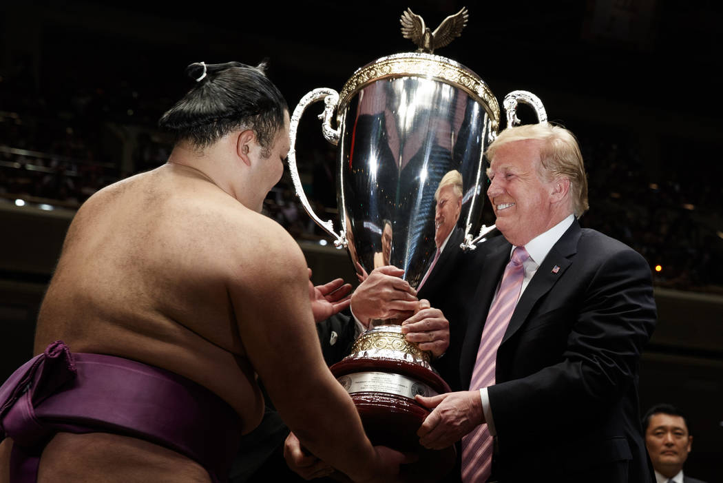 President Donald Trump presents the "President's Cup" to the Tokyo Grand Sumo Tournam ...