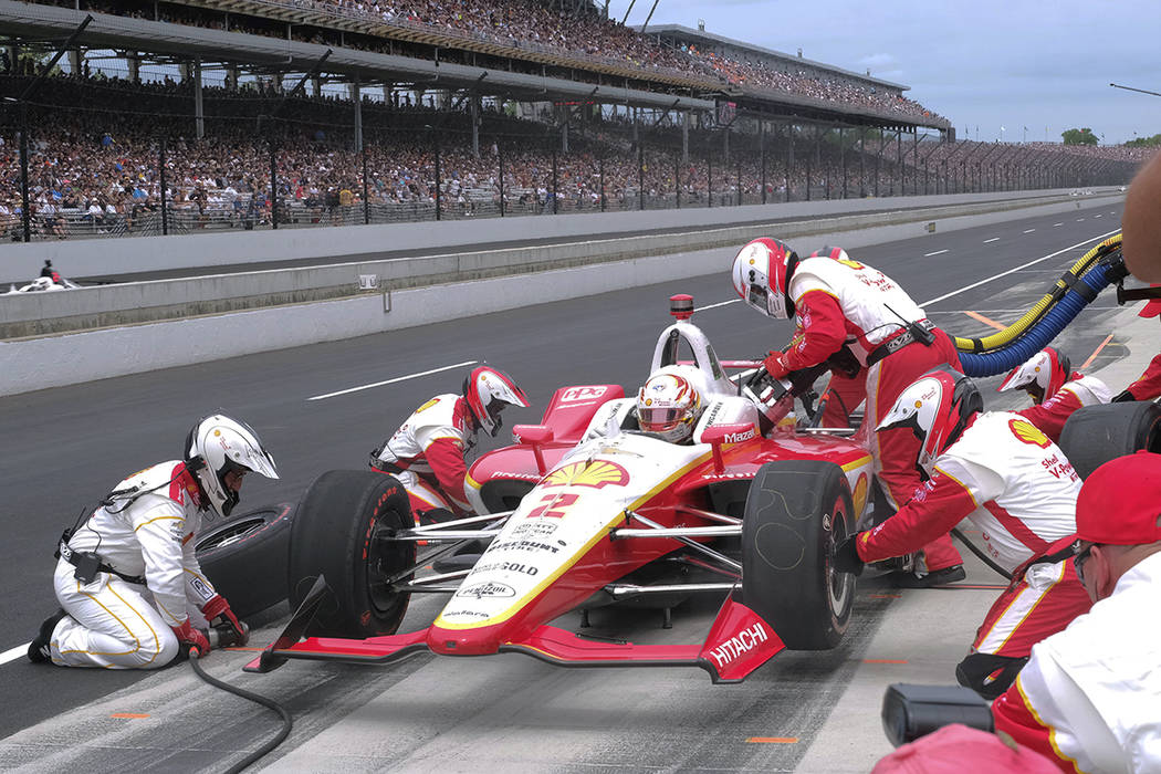 Josef Newgarden makes his first pit stop during the Indianapolis 500 IndyCar auto race at India ...