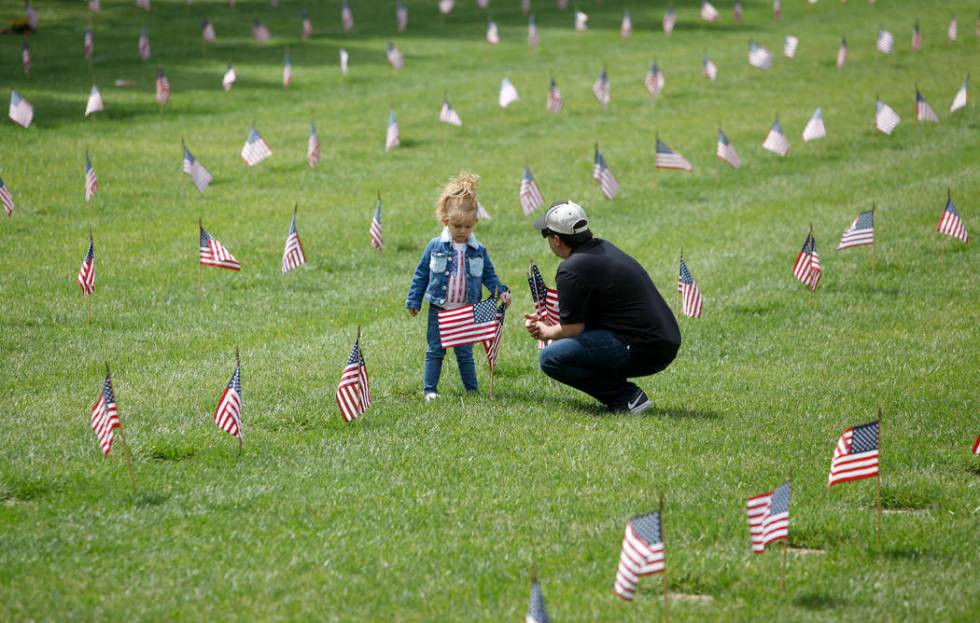 Liyah Makarechian, 3, sits with her dad Paul Makarechian at the Southern Nevada Veterans Memori ...