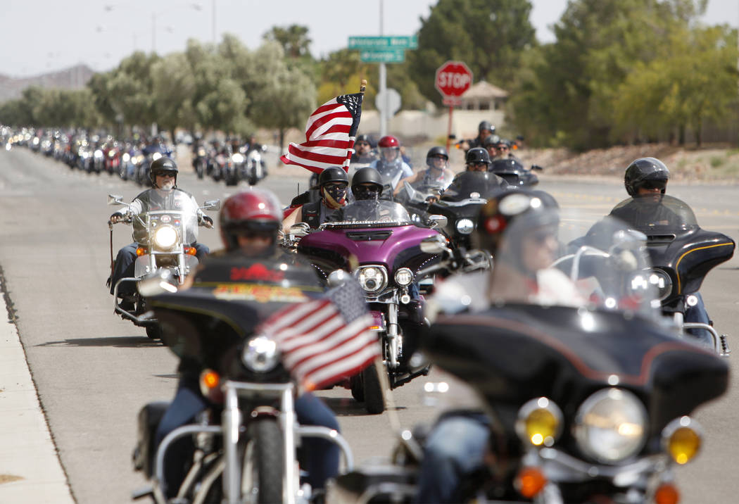 Hundreds of motorcyclists pull up to the Southern Nevada Veterans Memorial Cemetery for a cerem ...