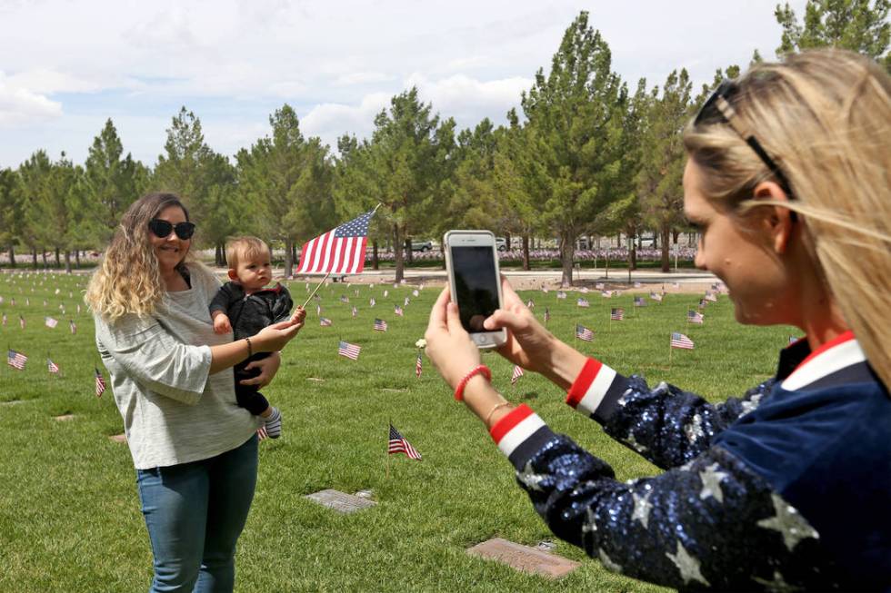 Anna Makarechian takes a photo of Yasmina Gimenez and Makarechian's son Orion Makarechian, nine ...