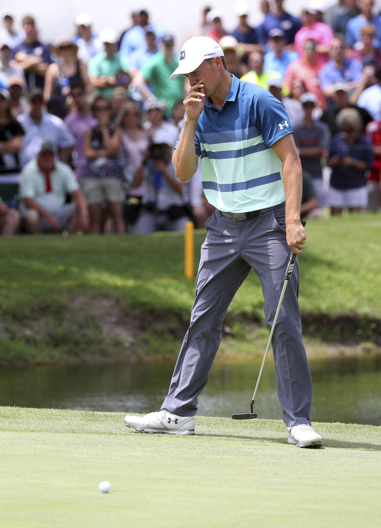 Jordan Spieth reacts after a missed putt on the ninth green in the final round of the Charles S ...