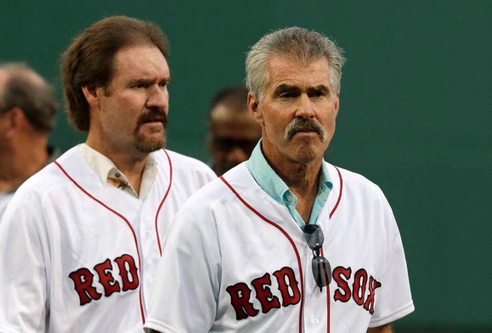 Former Boston Red Sox's players Bill Buckner, right, and Wade Boggs prior to a baseball game ag ...