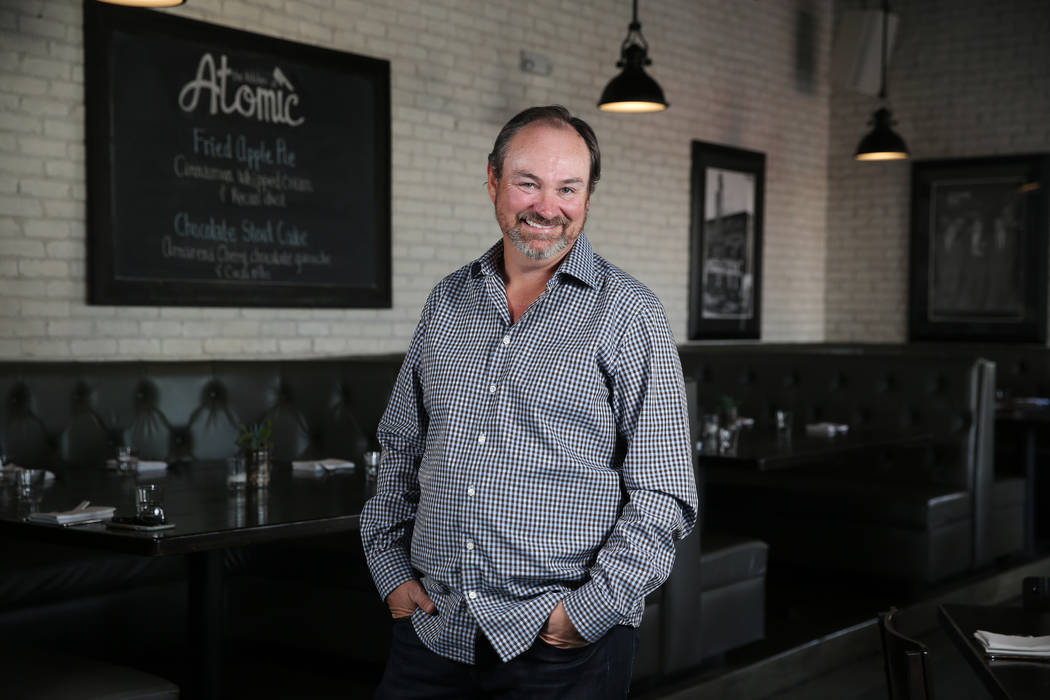 Lance Johns, owner of the Kitchen at Atomic, poses inside his restaurant in Las Vegas, Friday, ...