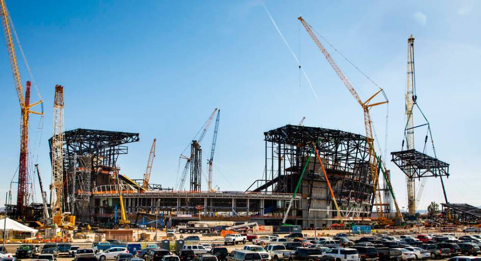The newest truss is lifted and soon attached to the top of Raiders Stadium on Wednesday, May 1, ...