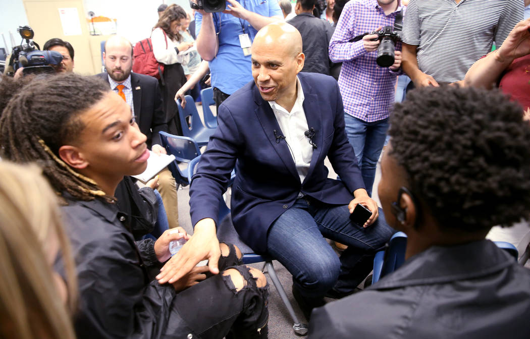 Presidential hopeful Sen. Cory Booker, D-N.J., tells Cheyenne High School senior Jeremiah Wrigh ...