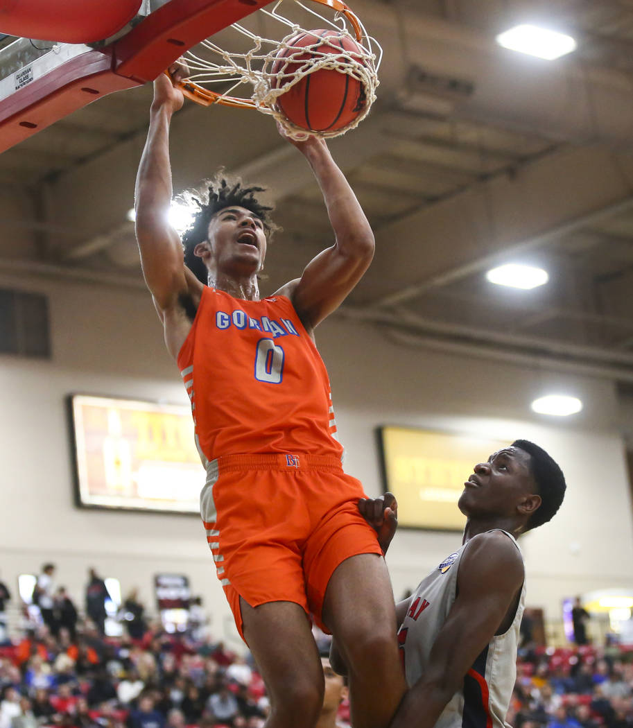 Bishop Gorman's Isaiah Cottrell (0) dunks over Findlay Prep's Alex Tchikou during the first hal ...