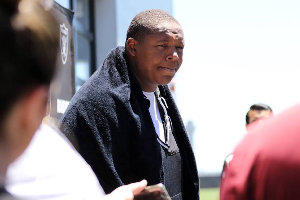 Oakland Raiders offensive tackle Trent Brown fields questions from reporters during a press con ...