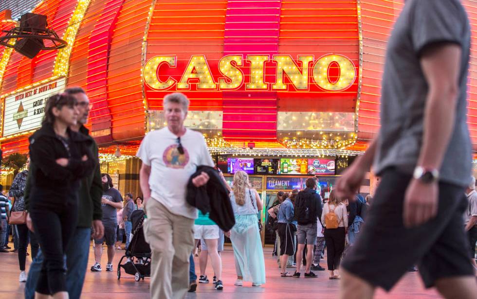 Fremont Street is packed with visitors on Thursday, March 28, 2019, in Las Vegas. (Benjamin Hag ...