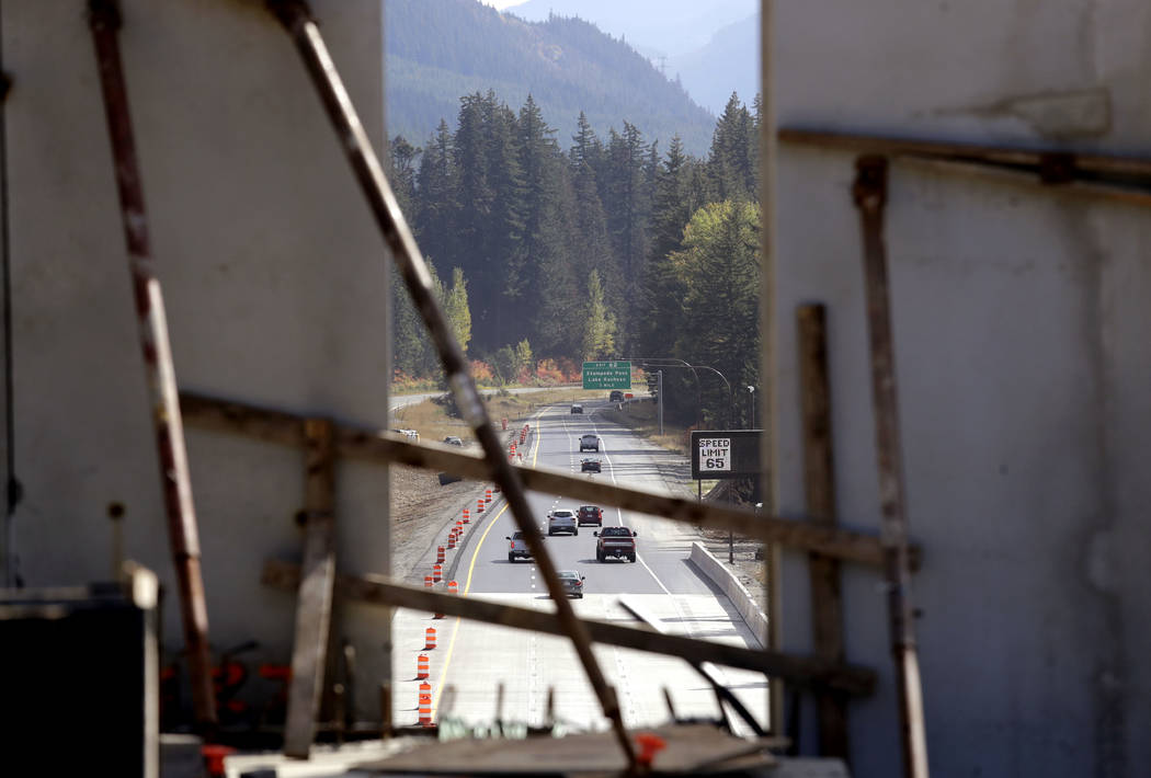 FILE - In this Oct. 4, 2018, file Interstate 90 traffic passing beneath a wildlife bridge under ...