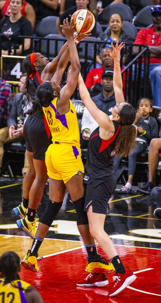 Las Vegas Aces guard Jackie Young (0) rejects a shot by Los Angeles Sparks forward/center Chine ...