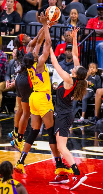 Las Vegas Aces guard Jackie Young (0) rejects a shot by Los Angeles Sparks forward/center Chine ...
