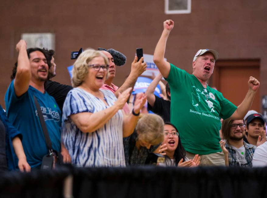 Supporters cheer as Democratic presidential candidate Sen. Bernie Sanders, I-Vt., speaks at a t ...