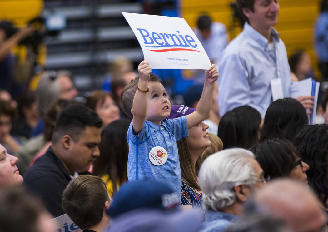 A young supporter holds up a sign in support of Democratic presidential candidate Sen. Bernie S ...