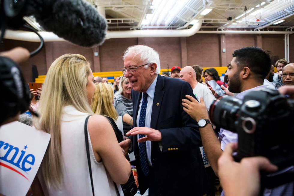 Democratic presidential candidate Sen. Bernie Sanders, I-Vt., greets supporters after a town ha ...