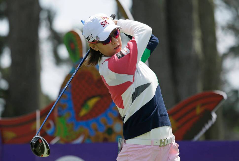 Na Yeon Choi, of South Korea, follows her drive from the second tee of the Lake Merced Golf Clu ...