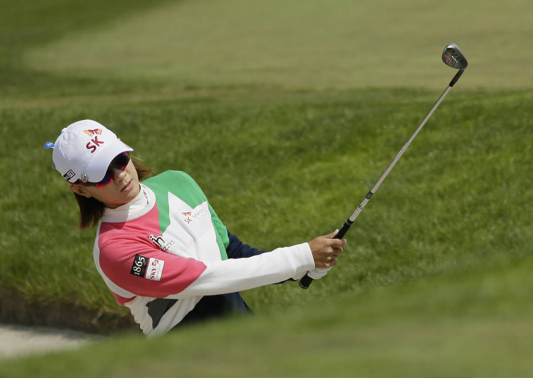 Na Yeon Choi, of South Korea, hits out of a bunker up to the fifth green of the Lake Merced Gol ...