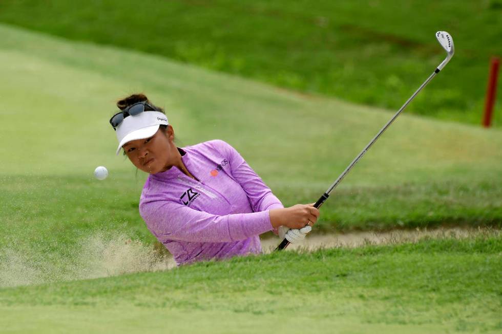 Danielle Kang hits out of a bunker on the fourth hole during the final round of the Hugel-Air P ...