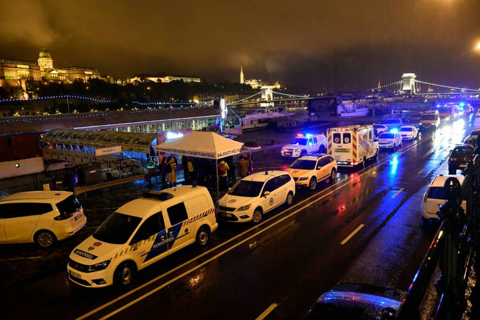 Police and ambulances are parked on the river bank early Thursday, May 30, 2019 after a tourist ...