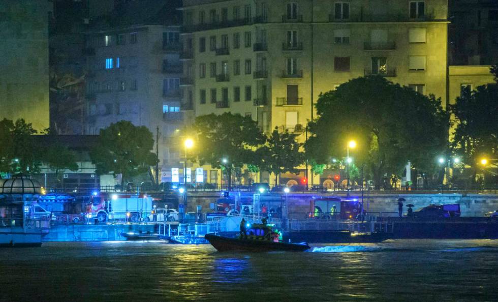 A rescue boat searches for victims late Wednesday, May 29, 2019, after a tourist boat crashed w ...