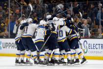 The St. Louis Blues mob Carl Gunnarsson, of Sweden, who scored the winning goal against the Bos ...