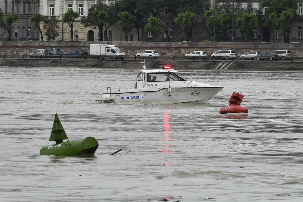 A fire brigade rescue boat takes part in the search operations for survivors on the River Danub ...