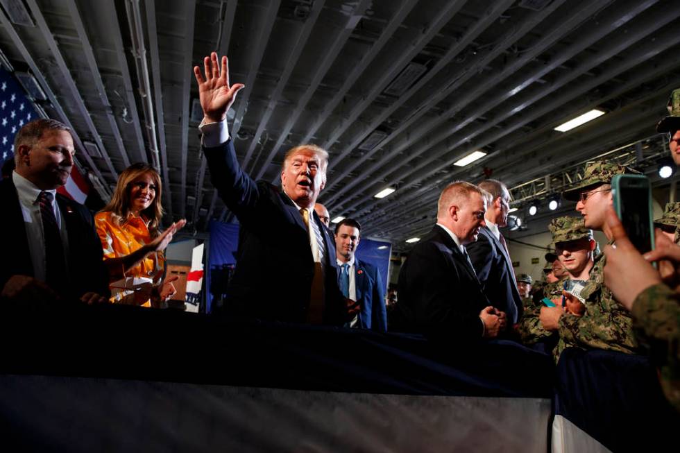 U.S. President Donald Trump talks with troops at a Memorial Day event aboard the USS Wasp amphi ...