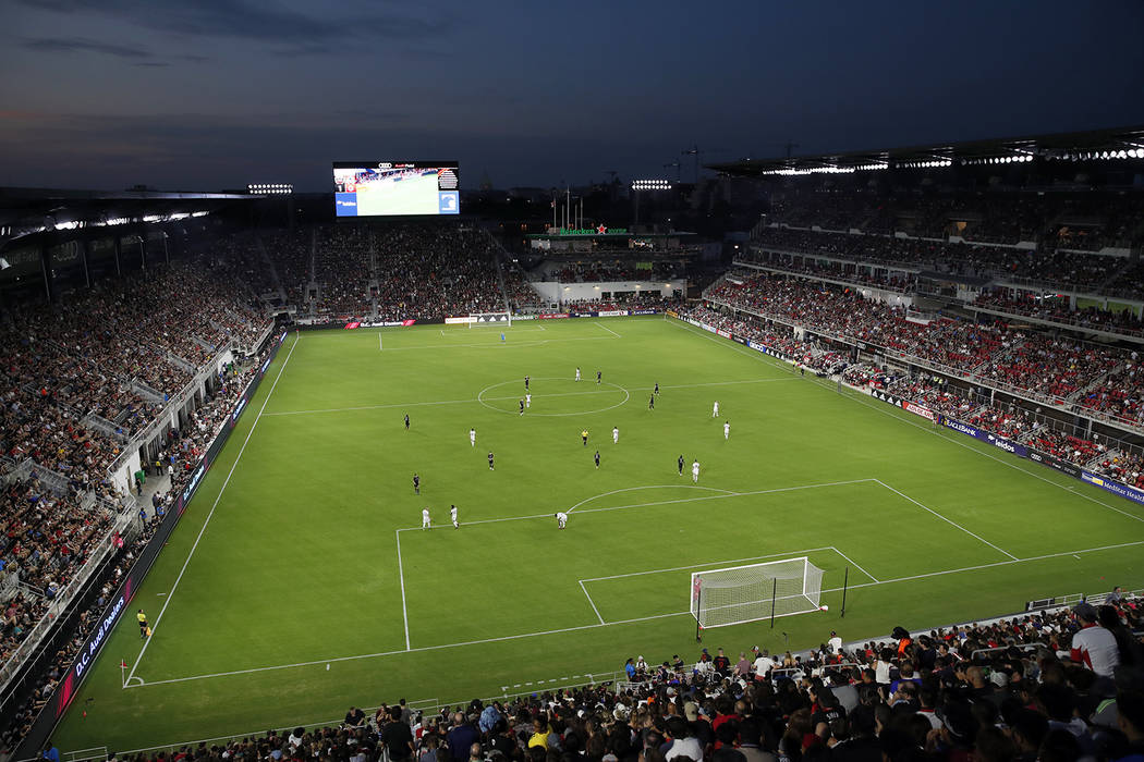 D.C. United and Vancouver Whitecaps play during the first half of an MLS soccer match, in this ...