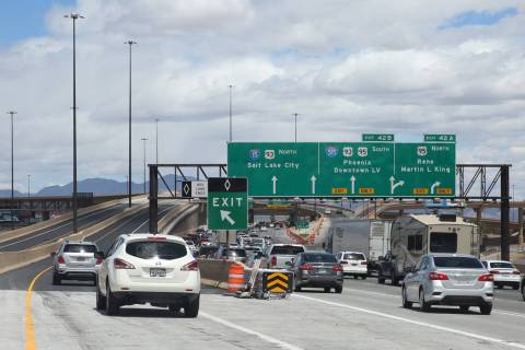 Motorists navigate through the newly completed Project Neon HOV flyover ramp in the Spaghetti B ...