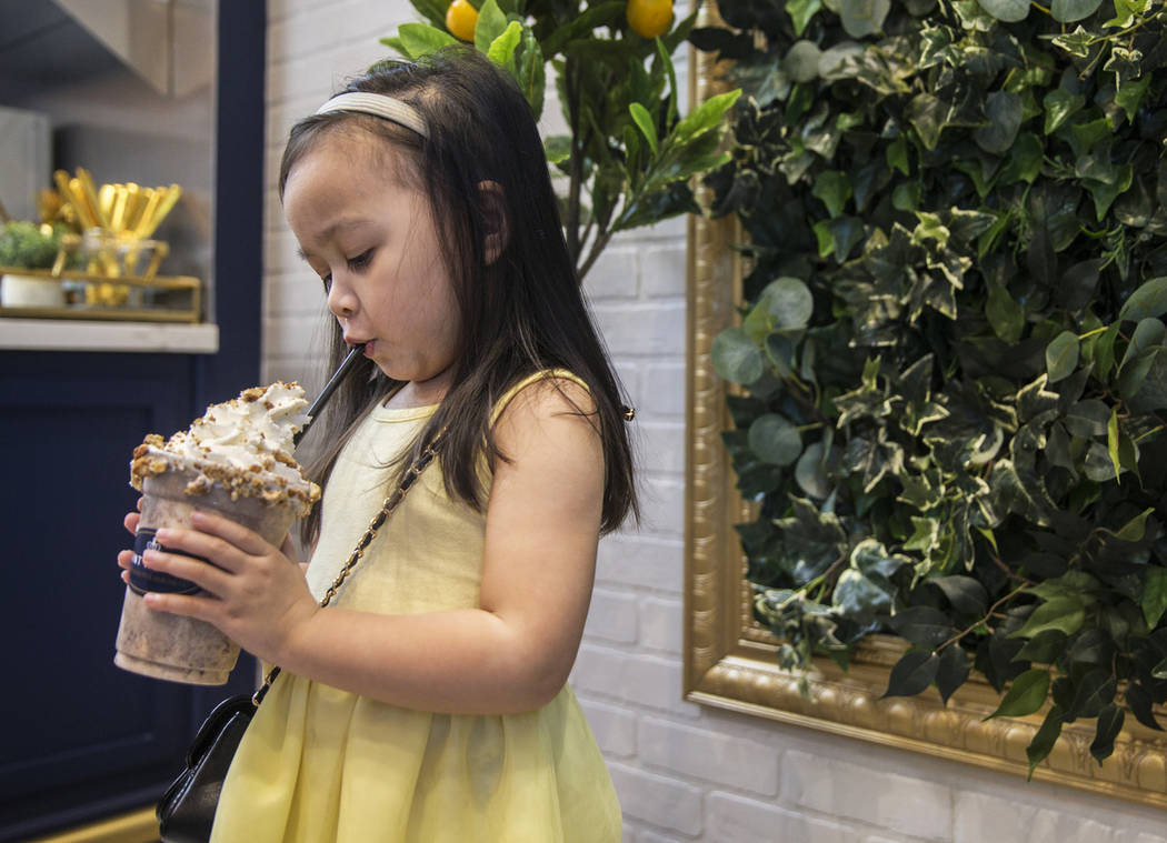 Ava Qassamali, 3, drinks her milkshake at Saint Honore on Saturday, June 1, 2019, in Las Vegas. ...