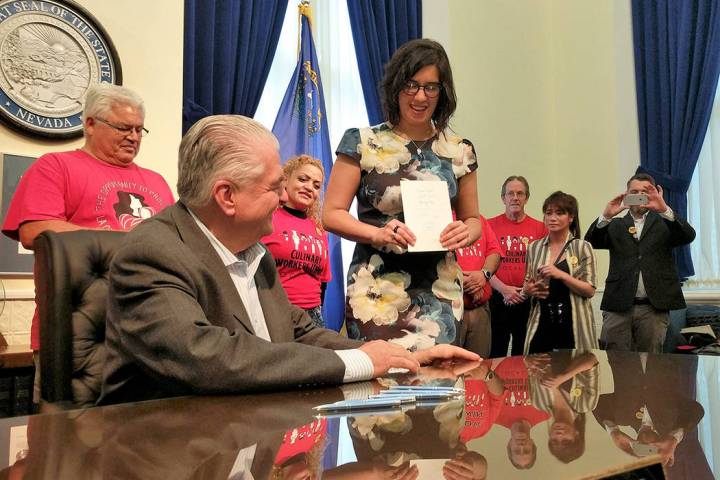 State Sen. Yvanna Cancela, D-Las Vegas, center, holds Senate Bill 262, which will require drug ...