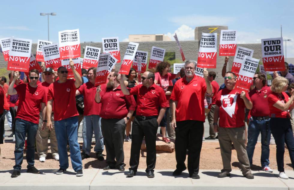 About 50 members and supporters of the Clark County Education Association protest in front of D ...