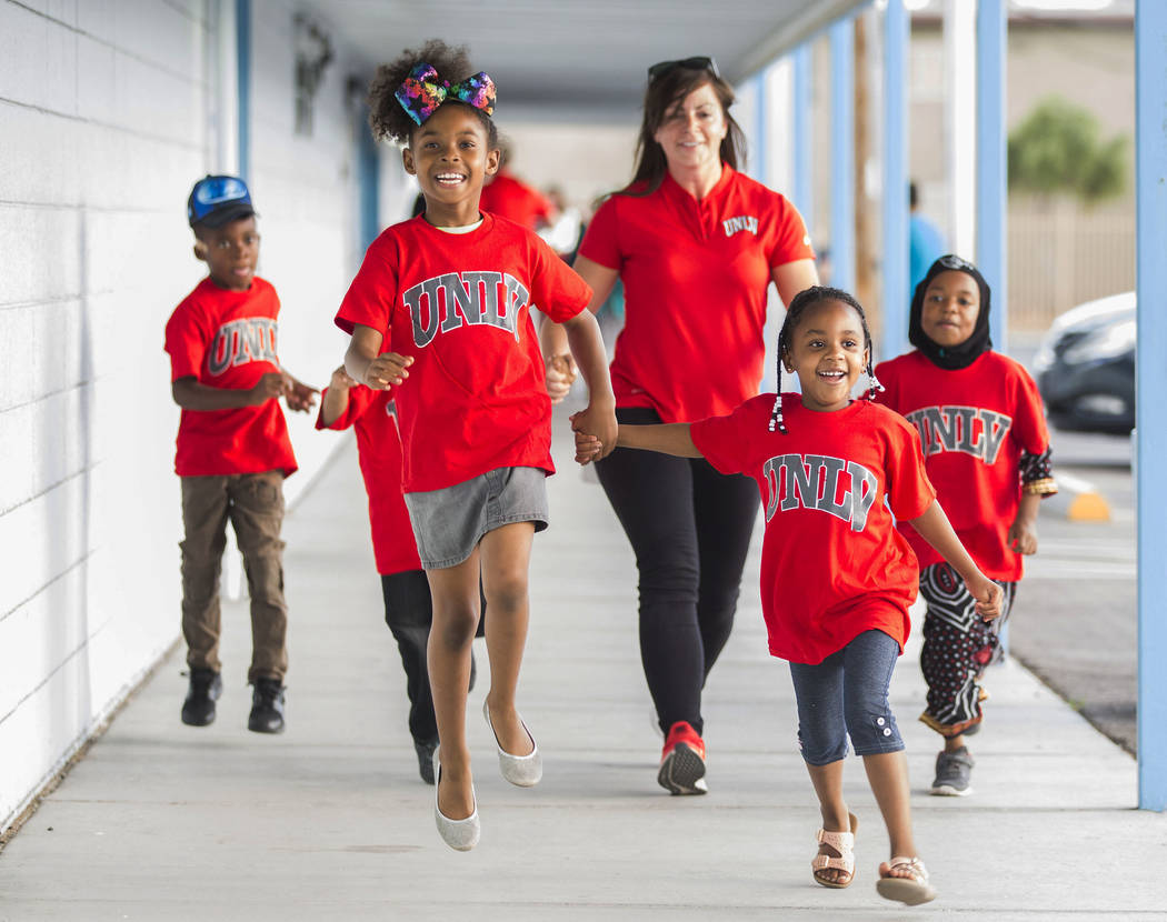 Kids with the Nevada Youth Network skip to a youth clinic hosted by UNLV head basketball coach ...