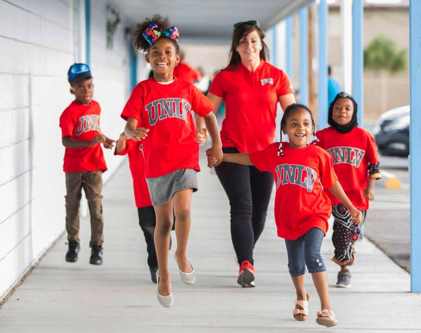 Kids with the Nevada Youth Network skip to a youth clinic hosted by UNLV head basketball coach ...