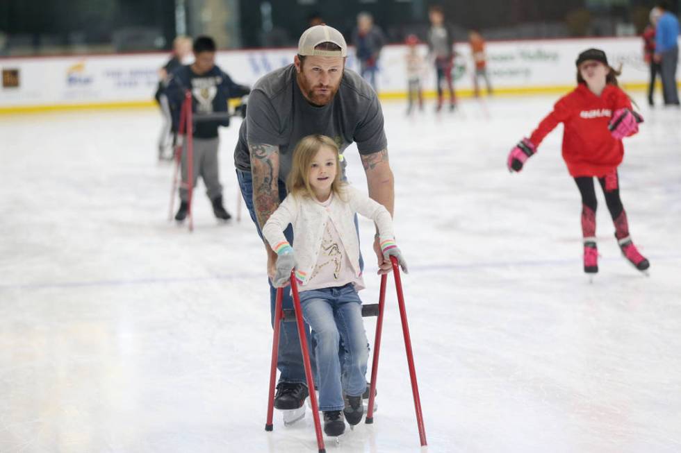 Tim Sussman of Las Vegas with his daughter Addie, 5, during the Jake Kielb's Hockey Foundation ...