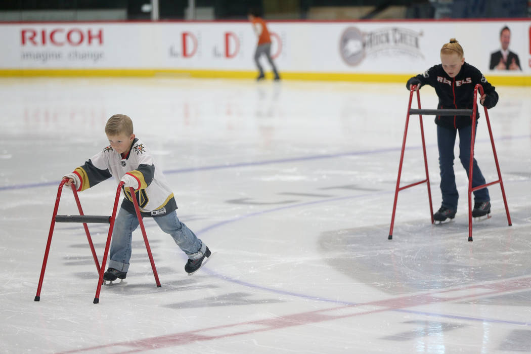Weston Gregory, 6, left, and his sister Daphne, 10, during the Jake Kielb's Hockey Foundation o ...