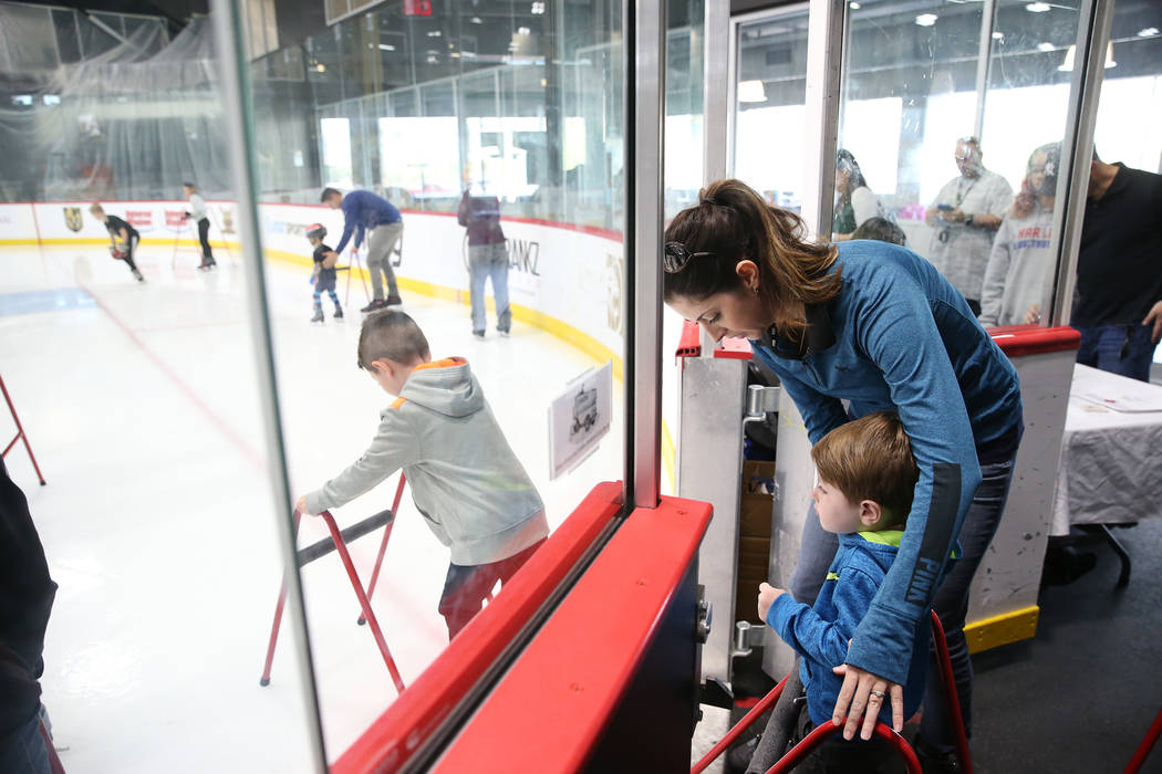 Erin Sturgeon of Las Vegas with her son Bryce, right, and Carsen, 5, left, during the Jake Kiel ...