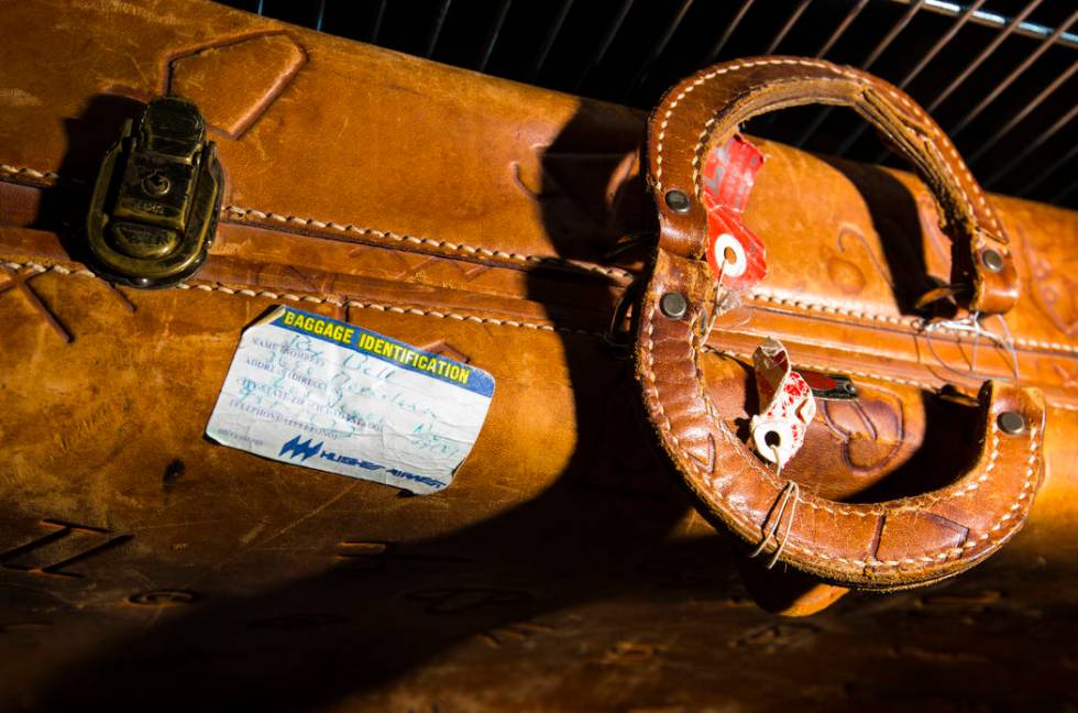 A leather suitcase with a handwritten ID tag from Rex Bell is seen as items from Walking Box Ra ...