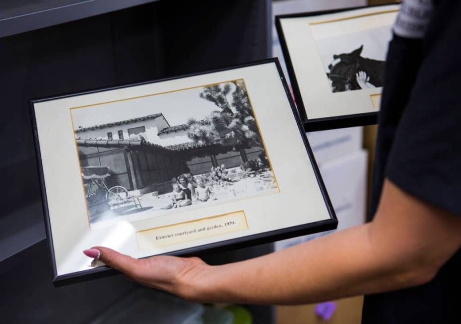 Deirdre Clemente, associate director of the UNLV public history program, holds a pair of framed ...