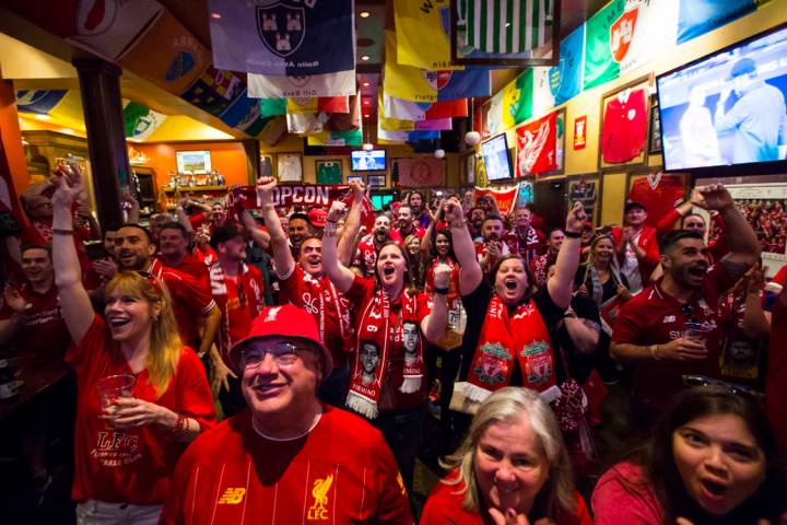 Liverpool fans, including Allison Gavin, center, and Shannon Theobald, right, both of Cleveland ...