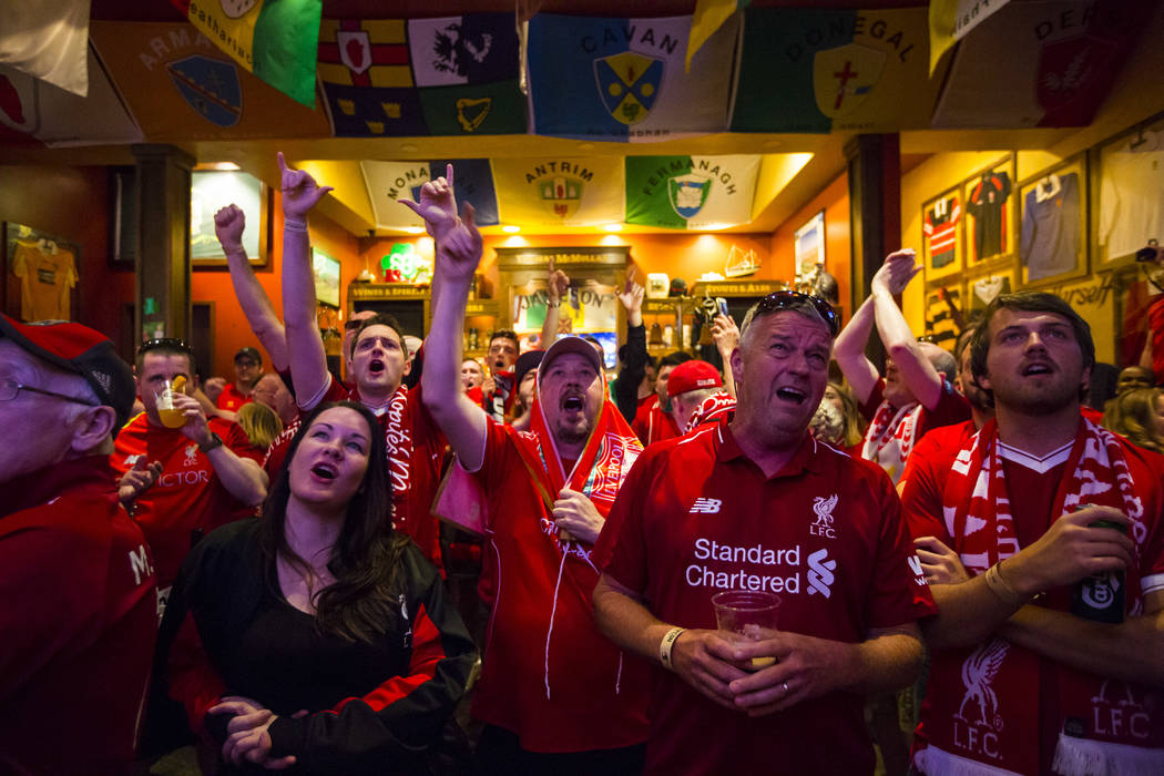 Liverpool fans cheer at the start of the Champions League final soccer match against Tottenham ...