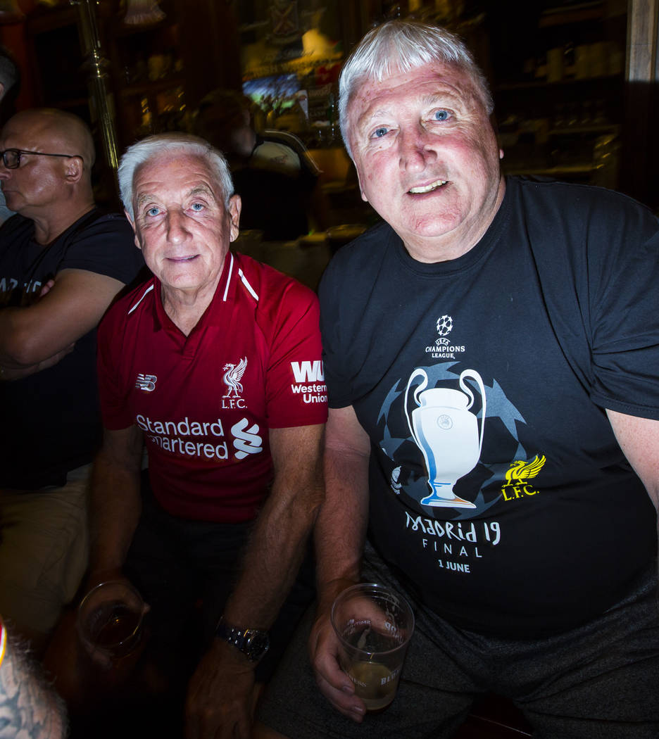 Former Liverpool coach Roy Evans, left, and former player David Johnson, right, attend a watch ...