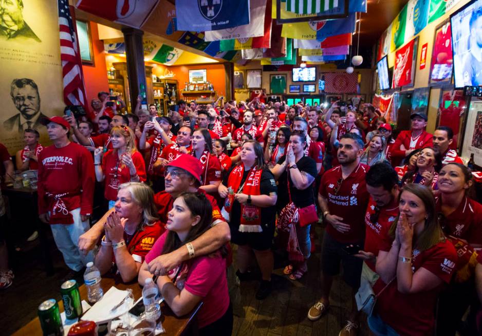 Liverpool fans react during a penalty shot at the start of the Champions League final soccer ma ...