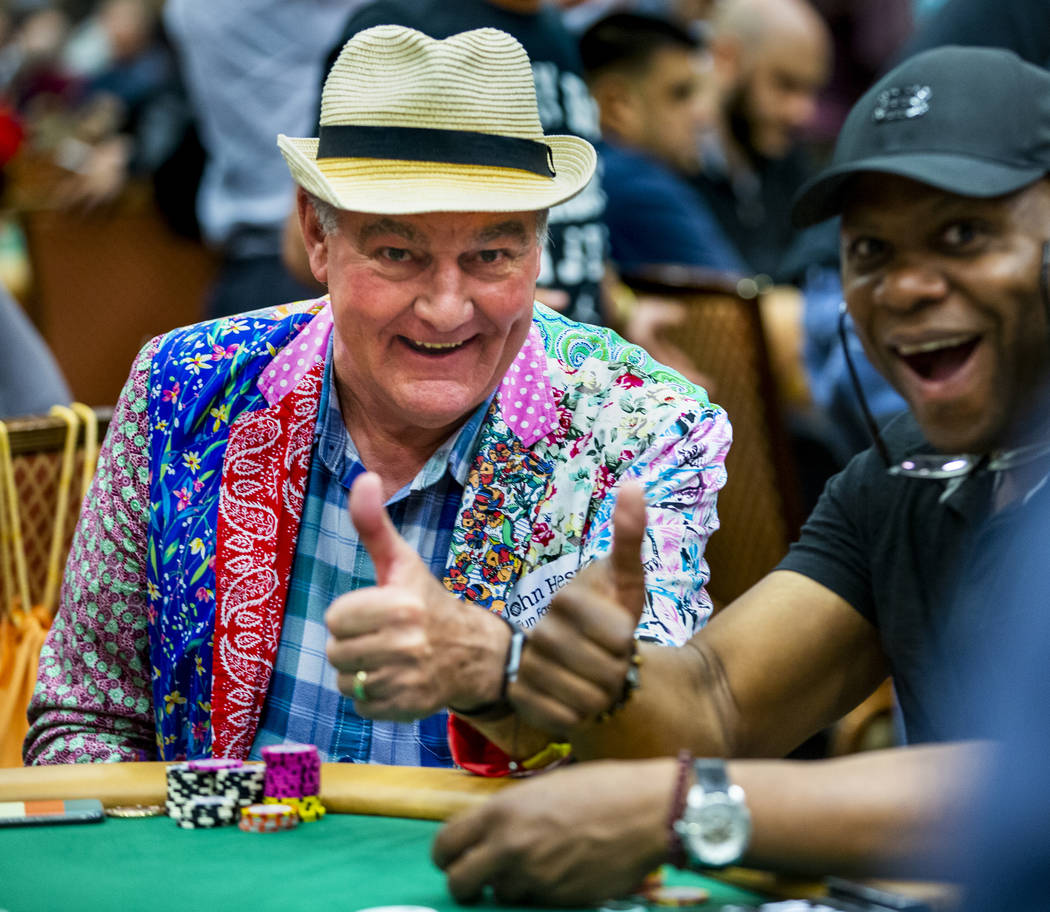 Professional poker player John Hesp, of Bridlington, U.K., left, poses for a photo with another ...