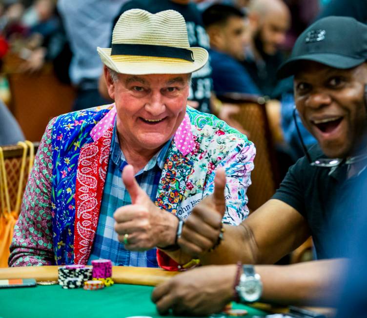 Professional poker player John Hesp, of Bridlington, U.K., left, poses for a photo with another ...