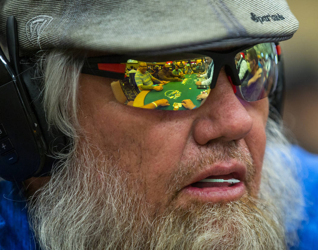 Mark Hayes has the table and cards reflected in his shades during the The Big 50, a $500 buy-in ...