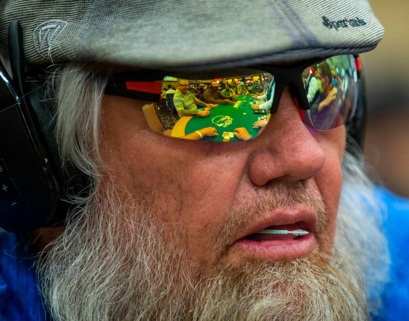 Mark Hayes has the table and cards reflected in his shades during the The Big 50, a $500 buy-in ...