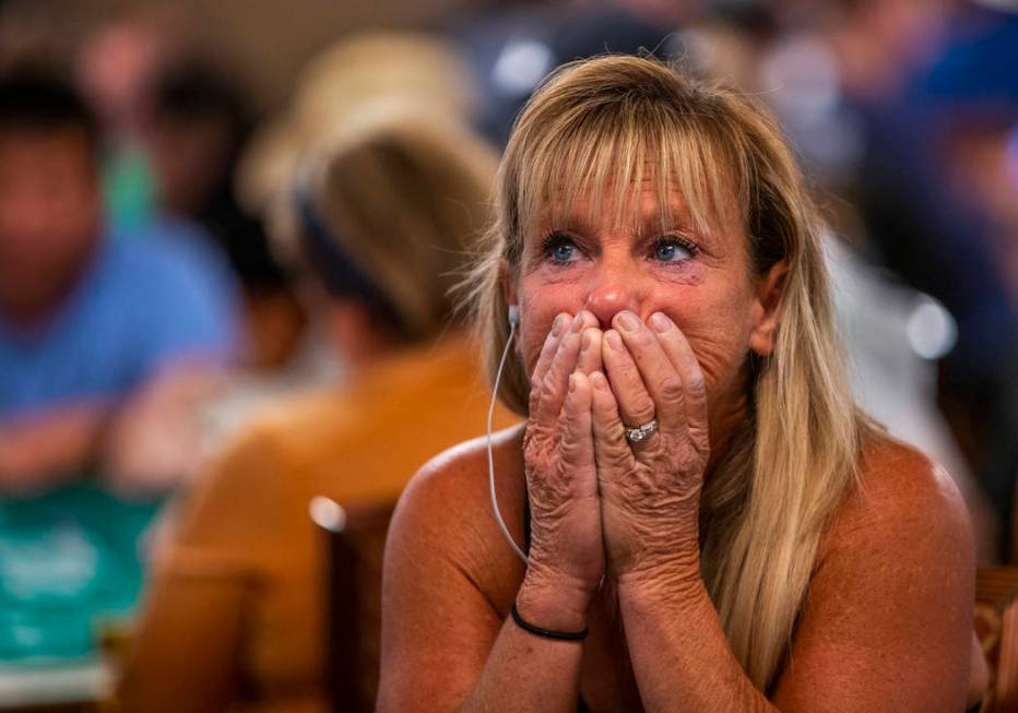 Kim Emmett, of Chicago, reacts as stakes get high during the The Big 50, a $500 buy-in, no-limi ...